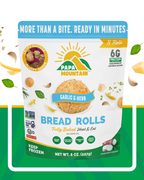 Papa Mountain Garlic & Herb cheese bread rolls packaging — gluten-free certified, non-GMO, grain-free, soy-free; clean-label, no seed oils (extra-virgin olive oil, virgin coconut oil); fully baked heat & eat, ready in 7 minutes; 6g protein per serving; frozen cheese bread rolls / gluten-free dinner rolls ideal for quick family meals, party appetizers, and air fryer; Georgia-grown, family-owned brand — shop online Papa Mountain Garlic & Herb artisan cheese rolls on a plate — aromatic ajo y hierbas, savory 
