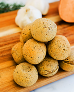 Papa Mountain Sweet Potato & Herb vegan bread roll split open — cozy sweet-savory camote/batata con hierbas; plant-based, dairy-free, egg-free, vegan (vegano); gluten-free certified (GFCO), Non-GMO Project Verified; clean-label, preservative-free, soy-free; no seed oils (with extra-virgin olive oil and virgin coconut oil); fully baked heat-and-serve, ready in ~7 minutes, air-fryer friendly; kid-friendly family snack, holiday side, quick weeknight roll; frozen gluten-free dinner rolls from a Georgia-grown, f